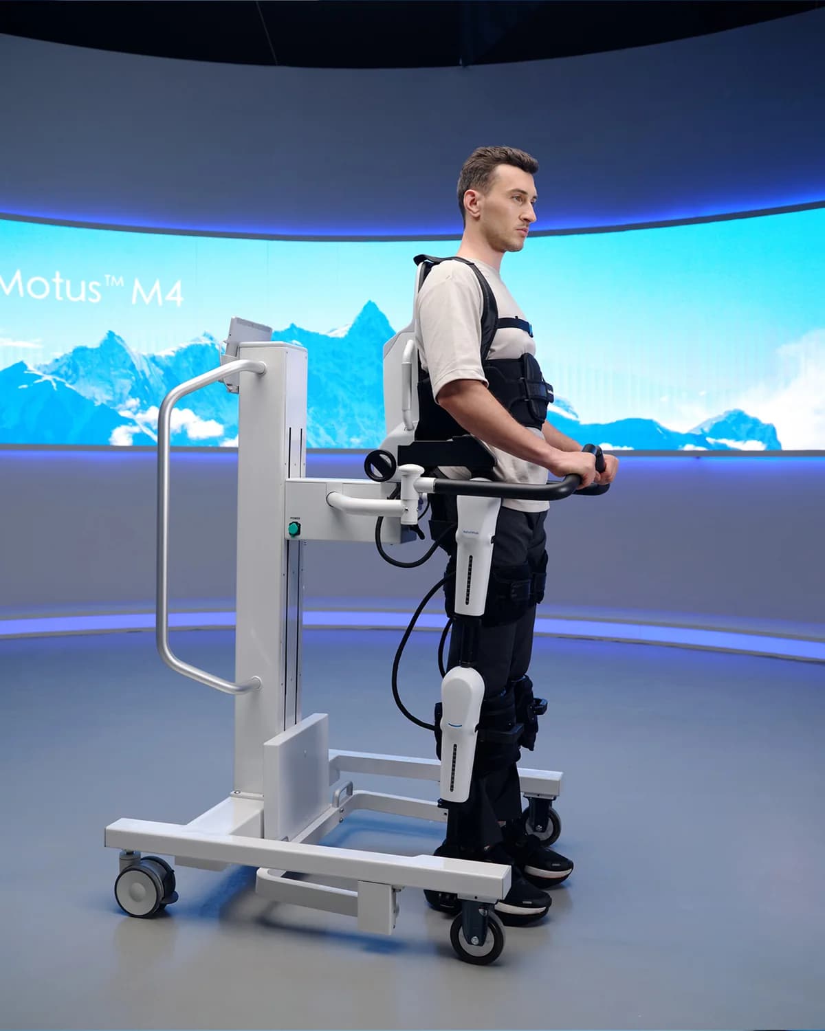 A patient standing in the Fourier ExoMotus M4 lower-limb exoskeleton.